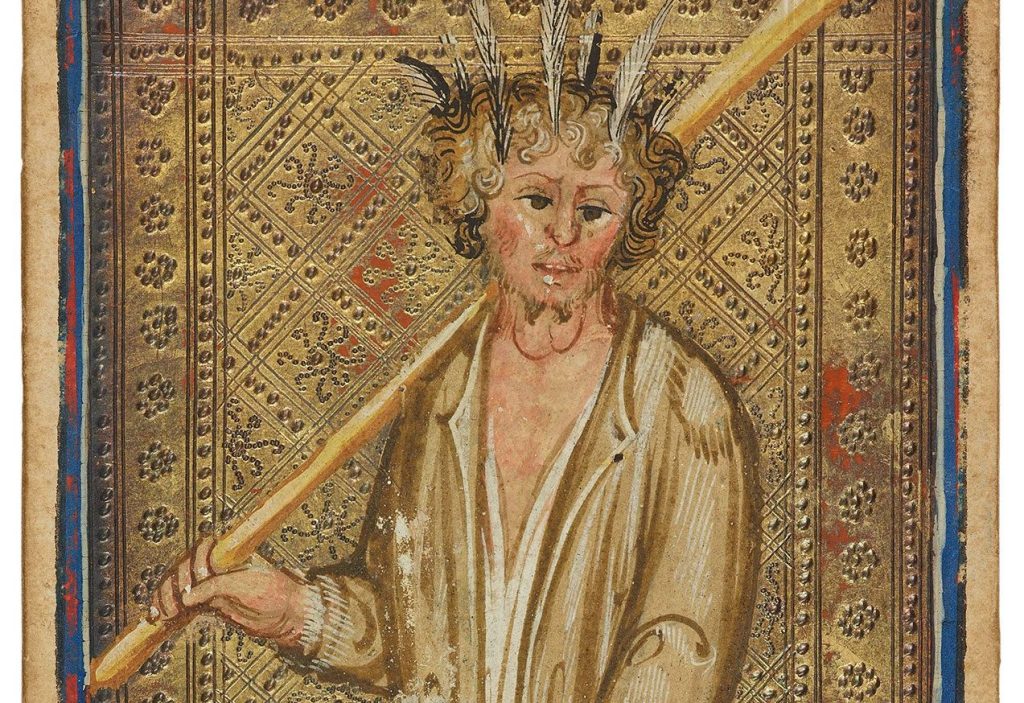 A 15th century Tarot Card of the Fool. A man in a rough tunic stands with his left foot forward. He has feathers in his hair and is holding a long bat over his right shoulder. Morgan Library, MS M.630 (no. 15)